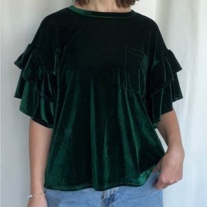 Green velvet top with ruffle sleeves and pocket